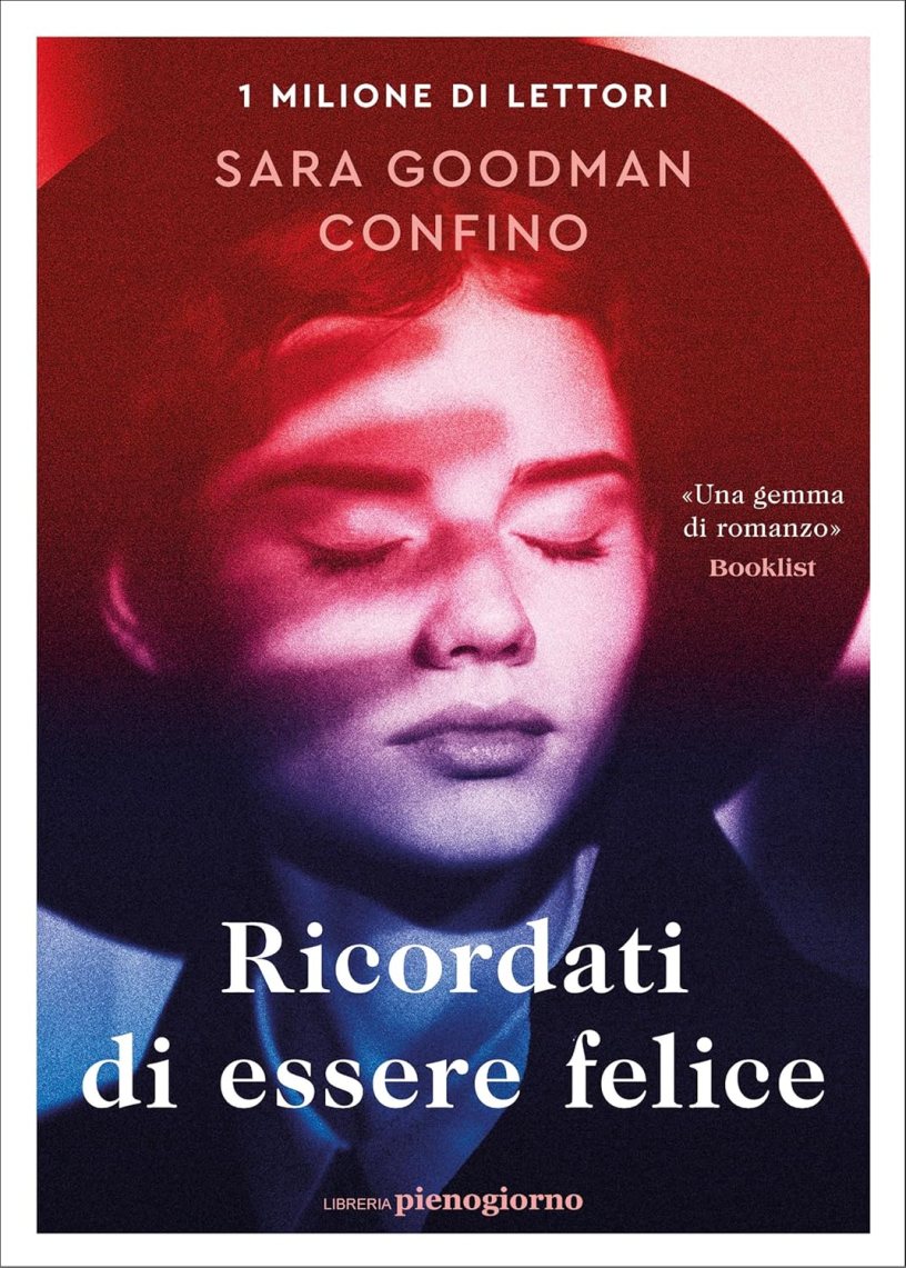 Copertina del romanzo Ricordati di essere felice di Sara Goodman Confino. Il volto di una giovane donna è illuminato da suggestivi giochi di luce nei toni del rosso e del blu, simbolo di un percorso interiore tra difficoltà, rinascita e ricerca della felicità.